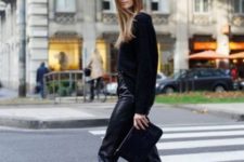 With leather pants, black clutch and jacket