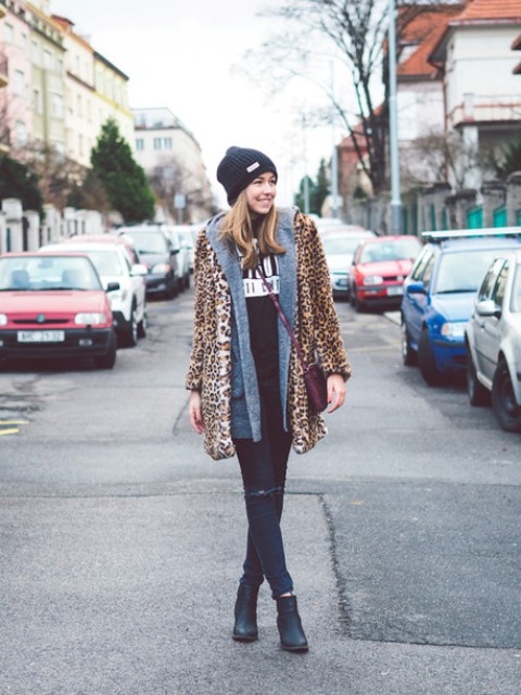 With leopard printed coat distressed jeans and black ankle boots