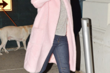 With light pink coat and boyfriend jeans