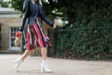 With midi colored skirt and black leather jacket