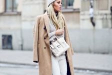 With midi neutral coat, white pants and beanie