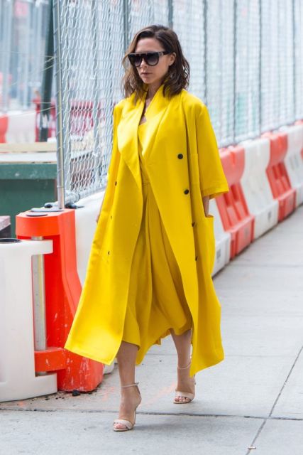 With midi yellow dress and neutral heels