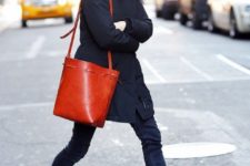 With mini coat, jeans, brown ankle boots and red bag