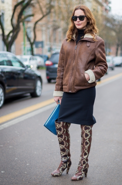 With navy blue skirt, leather jacket and clutch