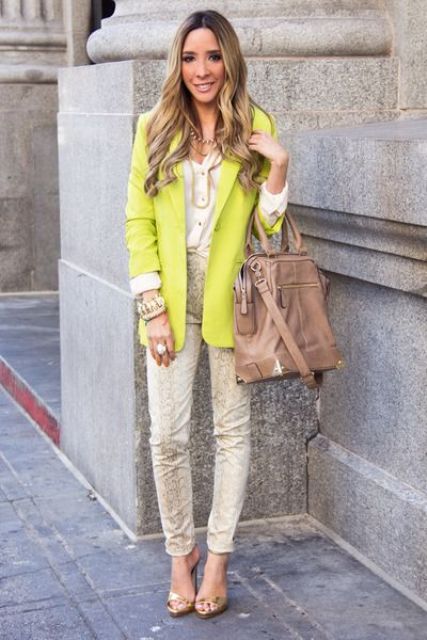 With neon blazer and camel bag