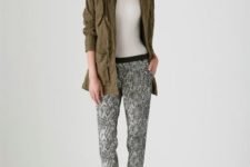 With olive green coat with fur and white t-shirt