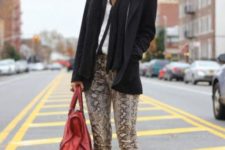 With oversized scarf, black blazer, ankle boots and red bag