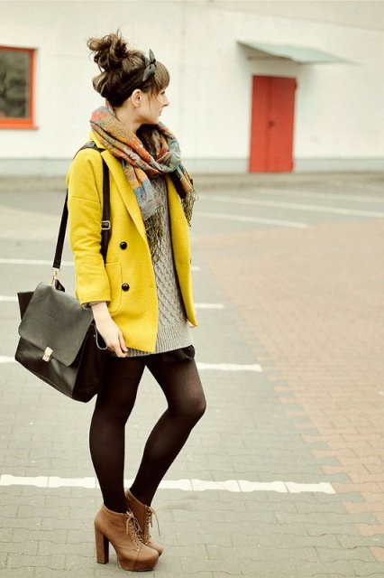 With oversized sweater, scarf and big bag