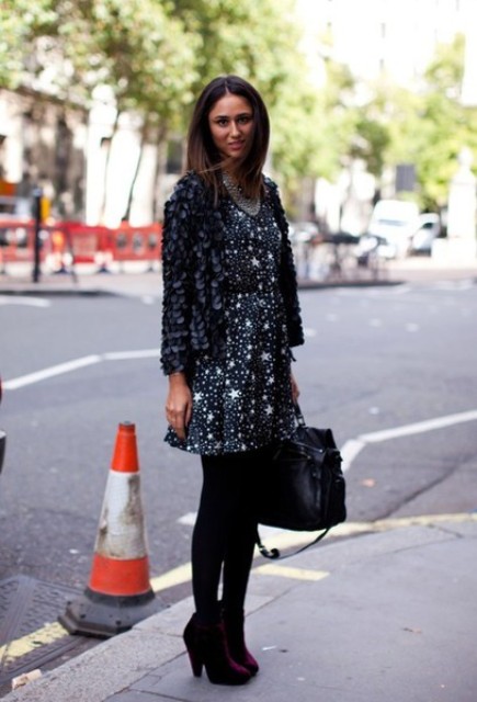 With printed dress, black tights and simple bag