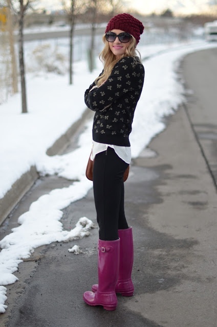 With printed sweater, black pants and beanie