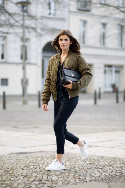 With puffer jacket, clutch and white sneakers