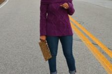 With purple sweater, cuffed jeans and eye-catching clutch