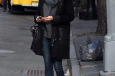 With skinny jeans, ankle boots and black knee-length coat