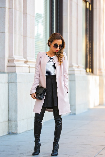 With striped shirt, high-waisted skirt and leather boots