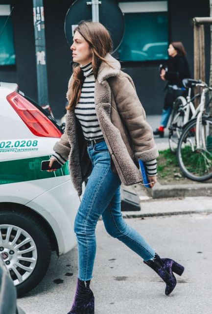 With striped turtleneck, crop jeans and shearling coat