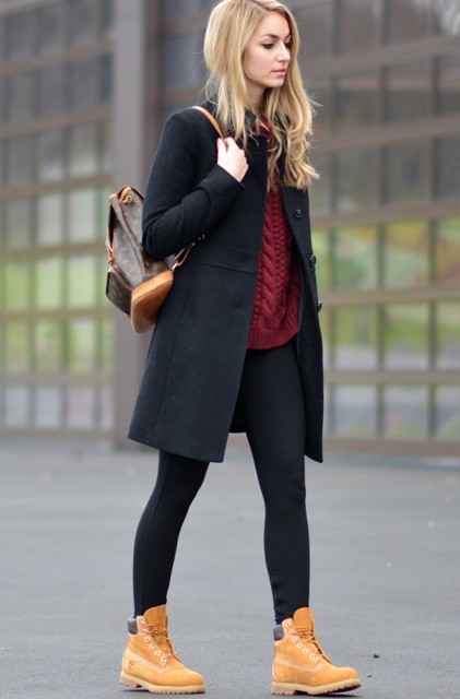 With sweater, skinnies and mini black coat