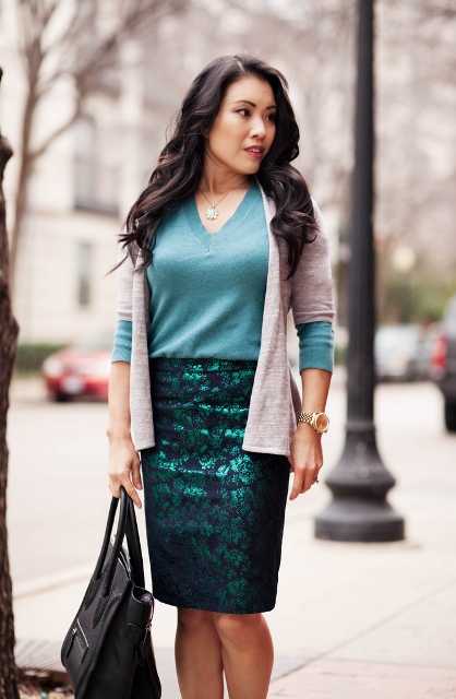 With teal shirt, pastel color cardigan and black bag