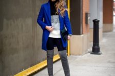 With two color sweater, pants and bright blue jacket