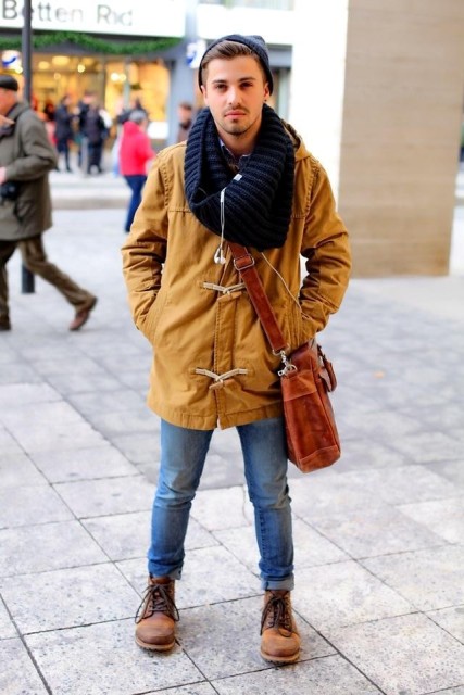 With unique parka, knitted scarf and jeans