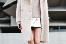 With warm knee-length coat and mini skirt