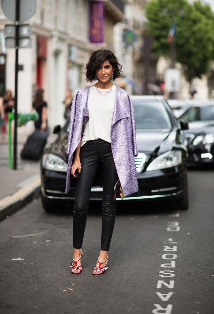 With white loose shirt, leather pants and heels