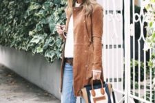 With white shirt, crop jeans, knee-length suede coat and mini bag