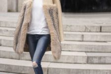 With white shirt, distressed jeans and fur coat