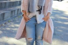 With white shirt, distressed jeans, gray scarf and black boots