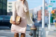 With white shirt, pastel color skirt and clutch