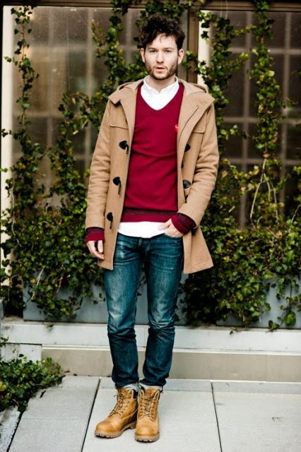 With white shirt, red sweater, camel coat and jeans