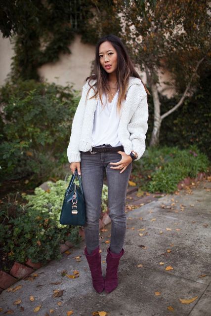 With white sweater, gray pants and emerald bag