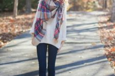 With white sweater, plaid scarf and jeans