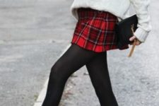 With white sweater, plaid skirt and black tights