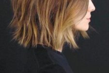 a beautiful brunette long bob with caramel and blonde highlights and messy waves is a chic and cool solution