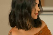 a black wavy long bob looks chic and beautiful, and waves soften the dark shade of the hair