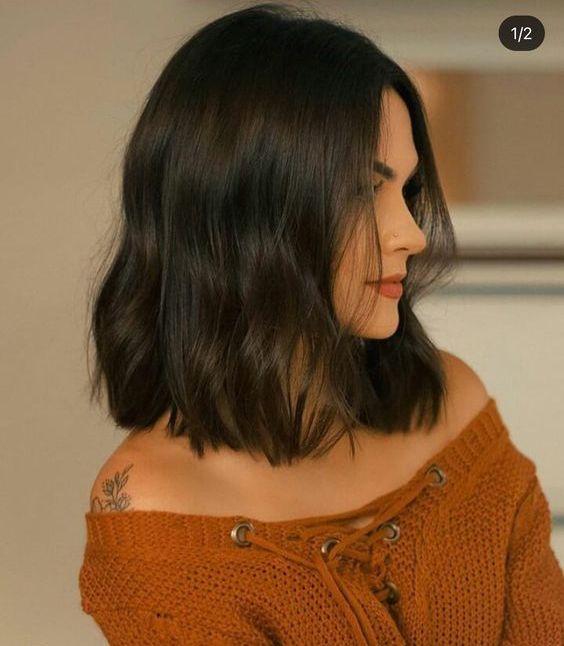a black wavy long bob looks chic and beautiful, and waves soften the dark shade of the hair