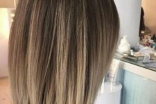 a brunette long bob with blonde highlights all over is a lovely idea to rock, it looks cool and bold thanks to the highlights