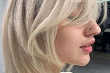 a chic icy blonde long bob with curtain bangs is a very cool idea that feels modern and edgy