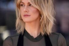 a cool blonde long shaggy bob with a darker root and curtain bangs is a very fresh and bold idea to wear right now