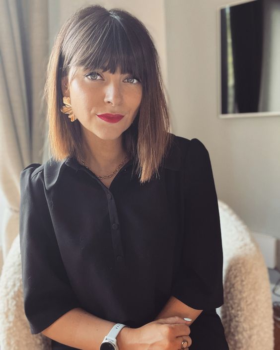 a dark brunette long bob with a caramel ombre touch and a classic fringe is a cool and stylish idea