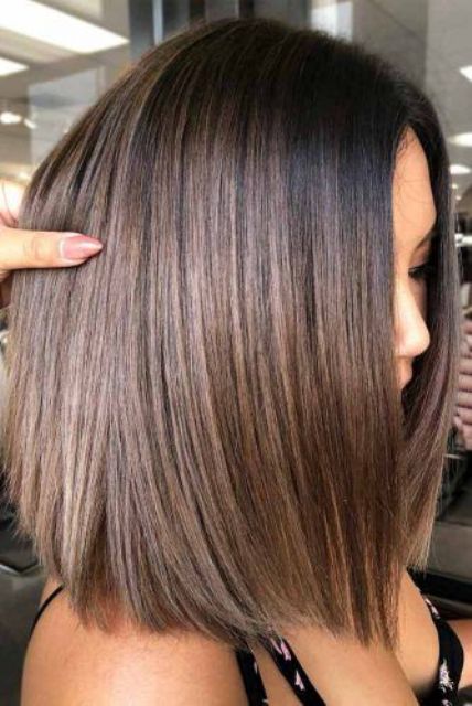 a dark brunette long bob with chestnut highlights and dark root is a catchy and stylish idea to rock