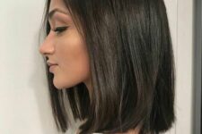 a dark brunette shoulder-length blunt bob is a stylish idea to rock, and such a shiny finish is perfect