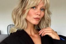 a long blonde wavy bob with curtain bangs can be styled as a half updo if it’s more comfrotable for you