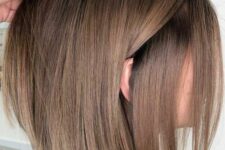 a lovely light brunette long bob with bronde highlights, lighter and darker ones, is a cool idea for a modern and fresh look