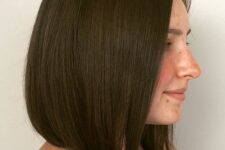 a sleek dark brunette long bob with curved ends is a catchy and cool idea, and it will look great both sleek and wavy