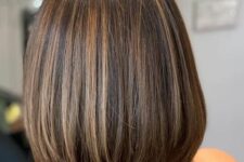 a stylish dark brunette long bob with caramel highlights is a catchy and lovely idea for a modern and fresh look