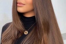 fab extra long chestnut hair, straight and with a lot of volume, is a lovely solution to rock