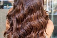 fantastic extra long and volumetric hair with copper balayage and waves looks really cool and adorable