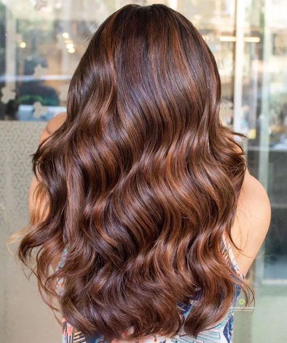 fantastic extra long and volumetric hair with copper balayage and waves looks really cool and adorable