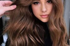 long and volumetric chestnut hair with waves is a beautiful and catchy idea to rock right now